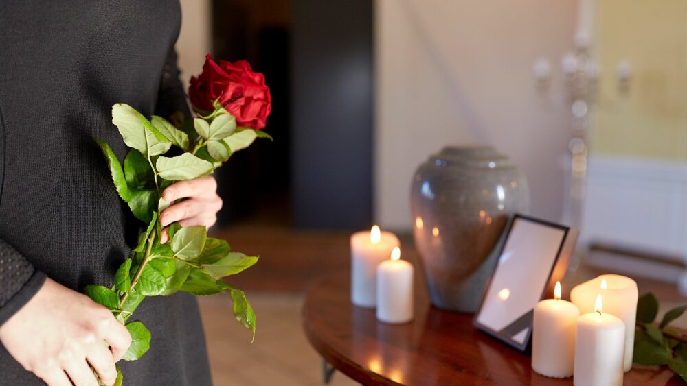 A person holding a rose